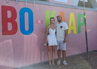 Couple visiting Bo Kaap colorful houses Cape Town South Africa