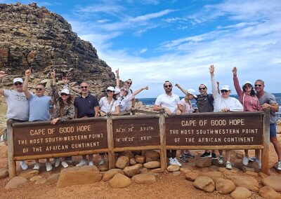 Tour group at Cape of Good Hope sign South Africa