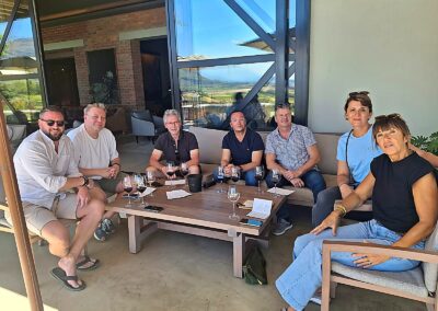 Luxury wine tour group enjoying tasting experience Cape Town