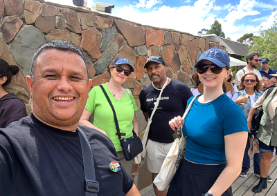 Tour guide and group of travelers smiling during a Cape Town guided tour